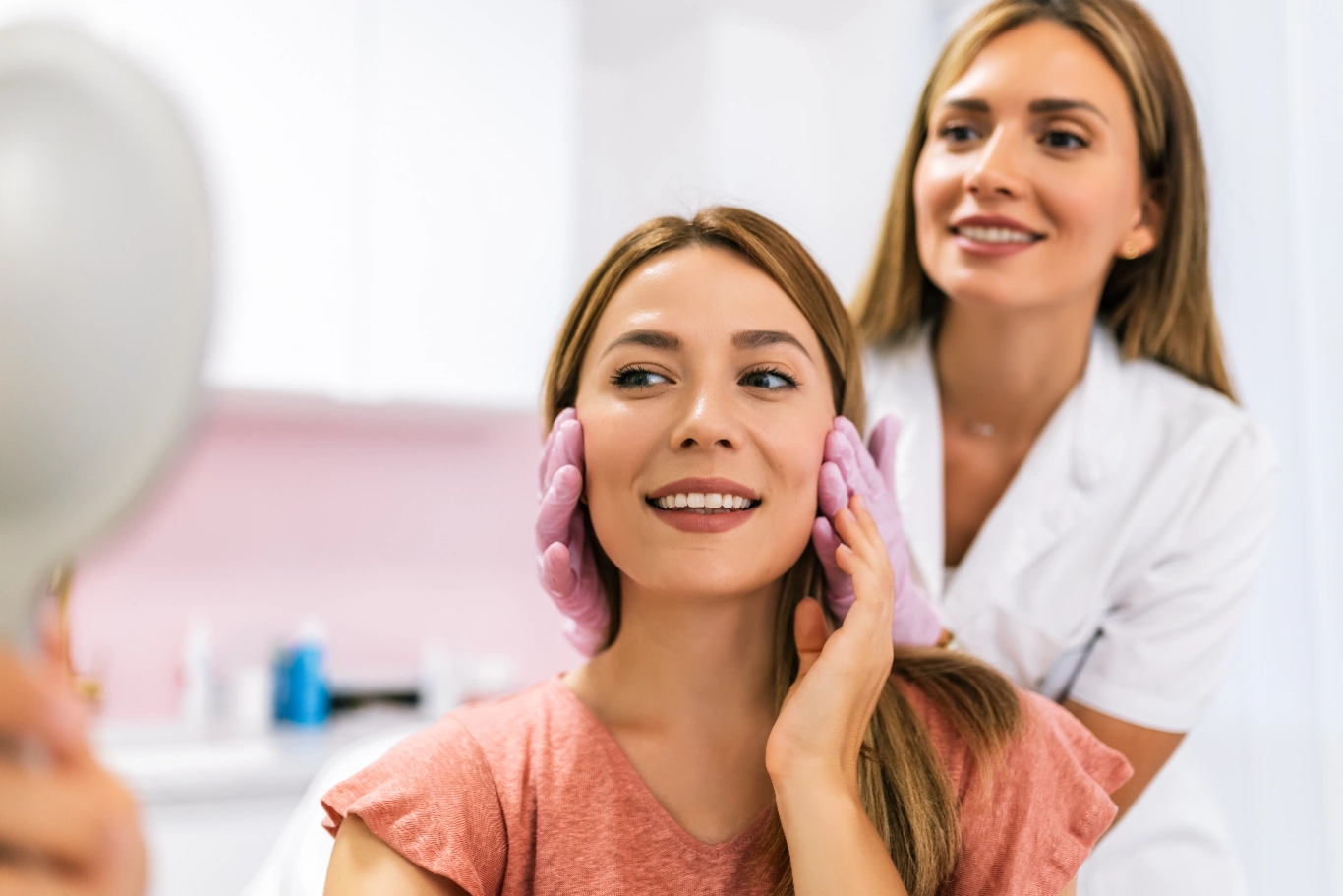 facial skin rejuvenation Patient admiring facial treatment results with professional guidance in medspa setting